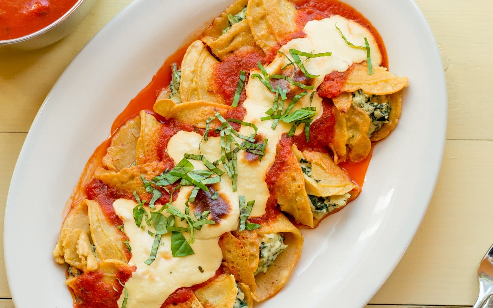 crespelle with spinach, ricotta, and marinara
