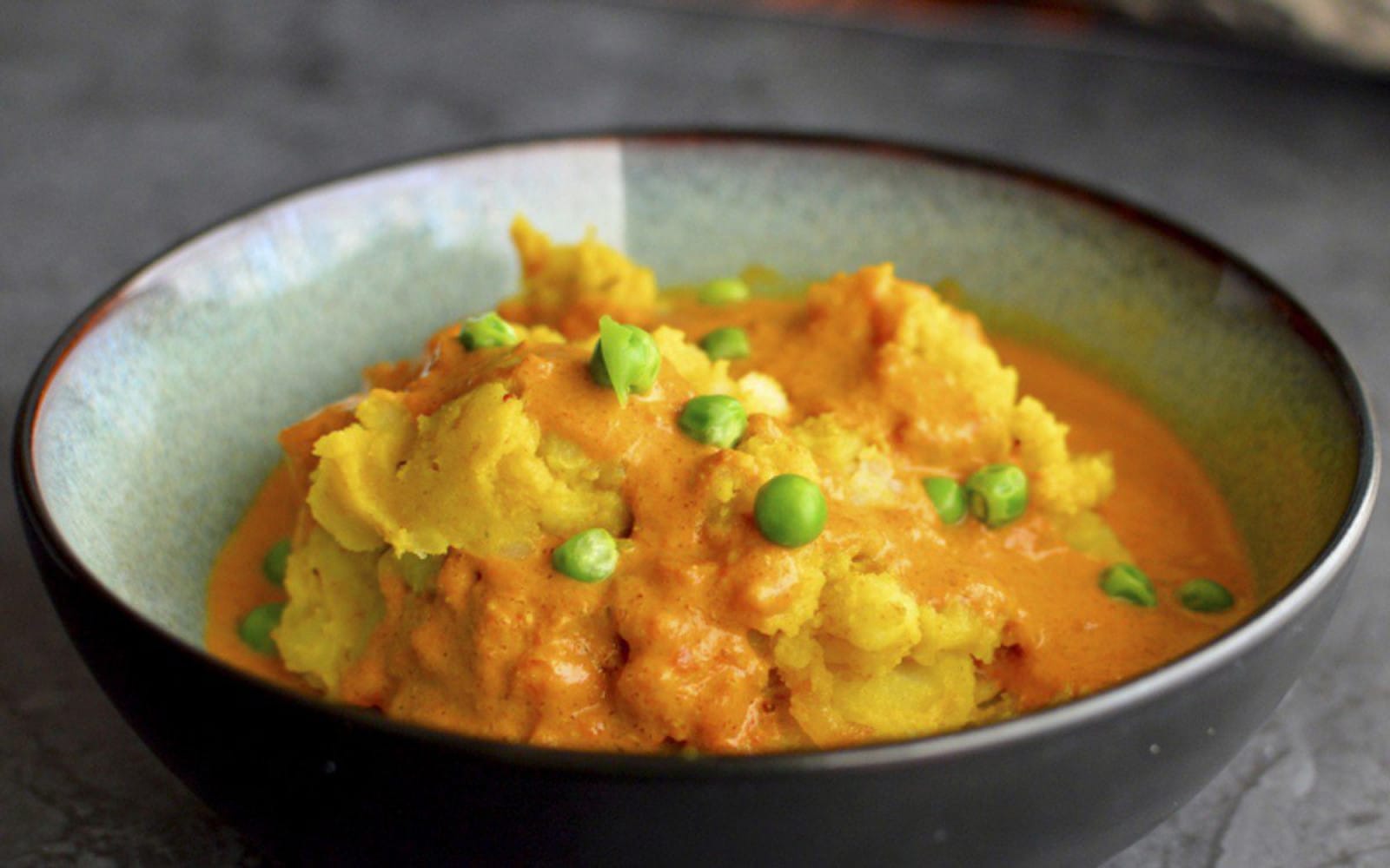 Indian golden mashed potatoes with curried gravy