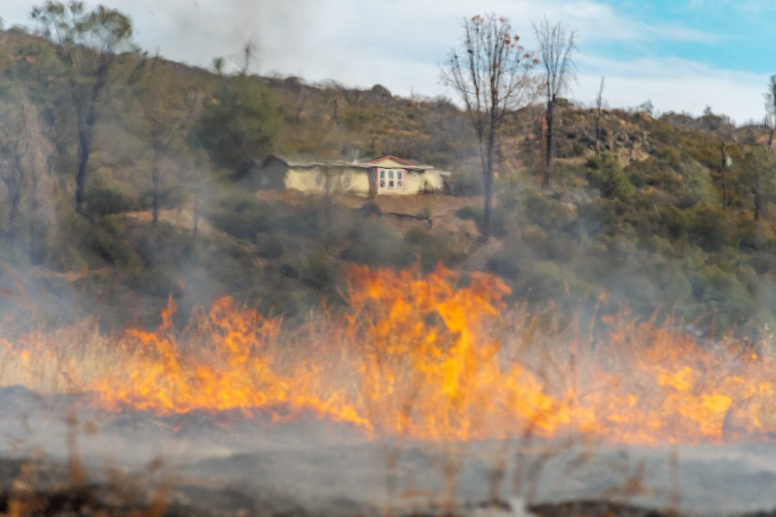 wildfire taking over near house